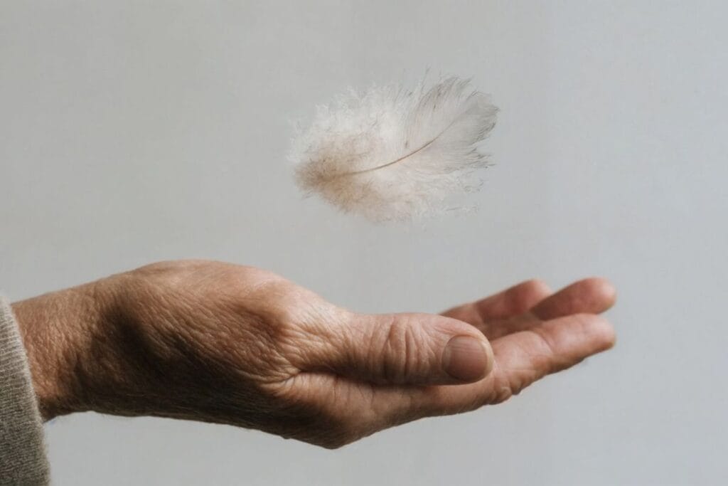 Open hand with a floating feather, symbolizing listening to your body and gentle awareness